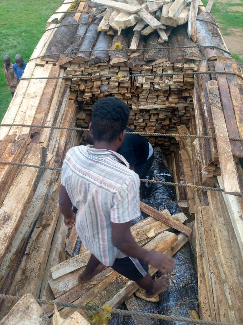 Bags of the illicit drug being offloaded from the truck