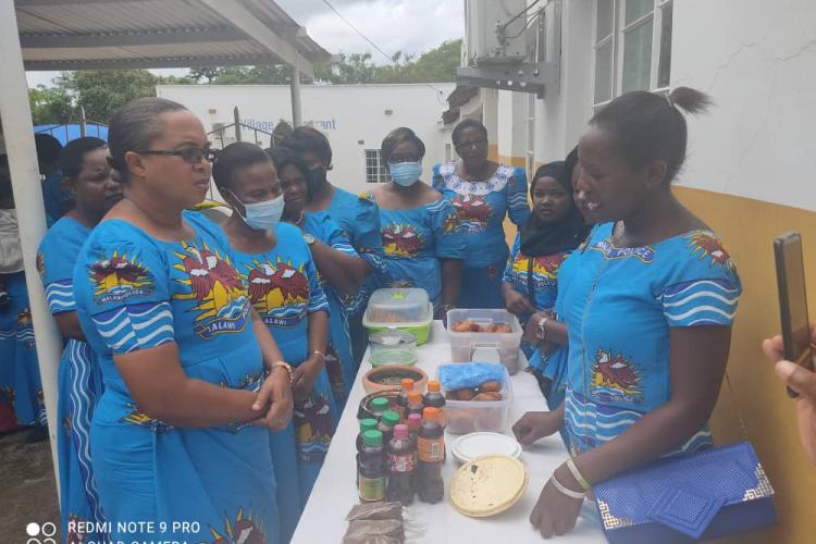 Mai Kainja admiring the work by Lunzu women welfare group