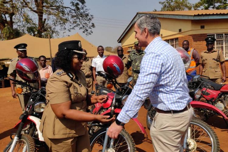 McAlpin handing over  keys for the motorcycles to the Officer-In-Charge, Msonkho