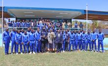 Group photo of Blue Eagles players and the Inspector General of Police